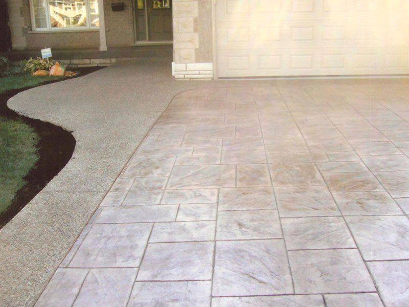 Patterned concrete, stonework and landscaping by Absolute Home Creations — project 29