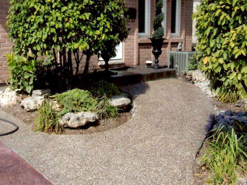 Patterned concrete, stonework and landscaping by Absolute Home Creations — project 33