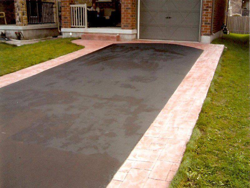 Patterned concrete, stonework and landscaping by Absolute Home Creations — project 35